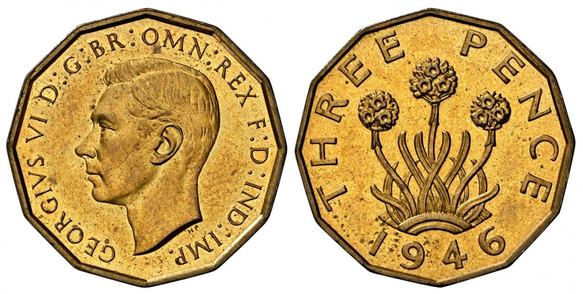 World Coins ("GREAT BRITAIN. George VI. 1946 Nickel-Brass Threepence. NGC MS65.  By T. H. Paget (Obv.) & Frances Madge Kitchener (Rev.). Head left / Thrift plant (allium porrum). KM 849; SCBC-4112; Peck 2388.

12-sided.

Please use this link to verify the NGC certific)